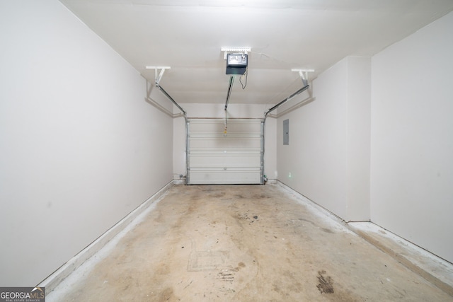 garage featuring a garage door opener and electric panel