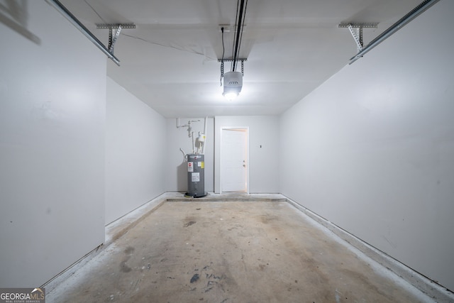 garage with a garage door opener and water heater