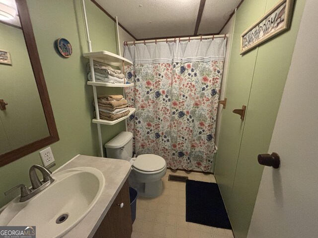 full bath with tile patterned floors, vanity, a shower with curtain, toilet, and visible vents
