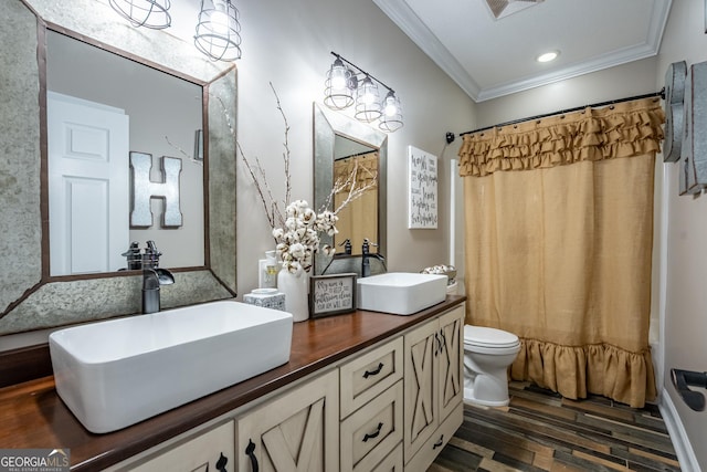 full bath with crown molding, a sink, wood finished floors, and toilet