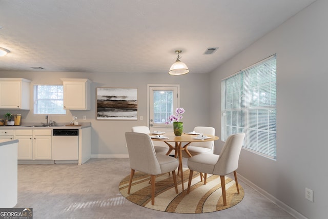 dining space with baseboards and visible vents