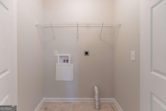 laundry area with baseboards, light tile patterned floors, washer hookup, hookup for an electric dryer, and laundry area