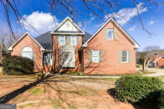 traditional-style house with brick siding