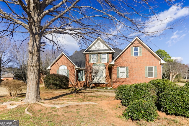 traditional-style home featuring brick siding