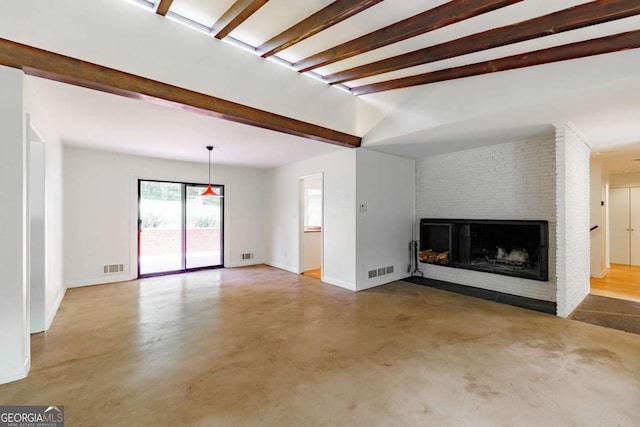unfurnished living room featuring a fireplace, visible vents, finished concrete flooring, and baseboards