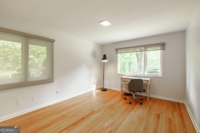 office featuring wood finished floors and baseboards
