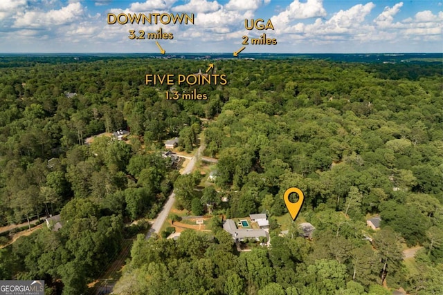 aerial view featuring a view of trees