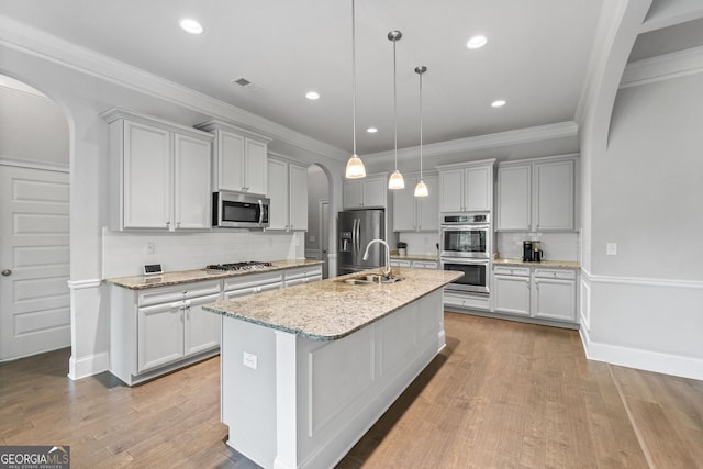 279 Sturry Dr, Mcdonough, GA 30252 - kitchen featuring arched walkways, backsplash, visible vents, and appliances with stainless steel finishes
