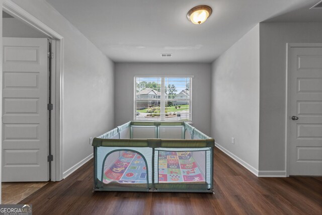 279 Sturry Dr, Mcdonough, GA 30252 - bedroom featuring baseboards, wood finished floors, and visible vents