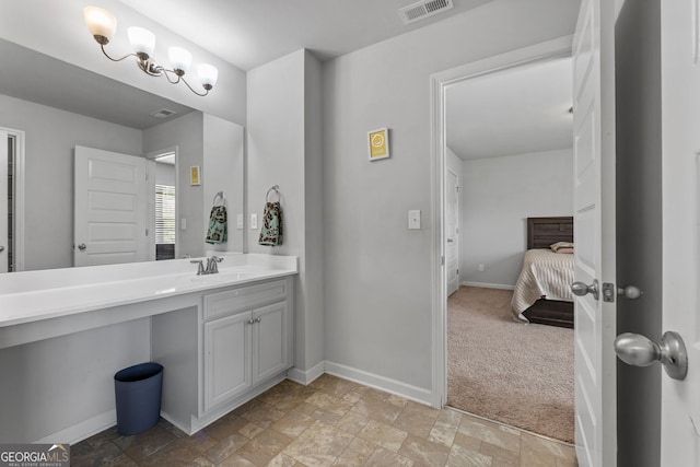 279 Sturry Dr, Mcdonough, GA 30252 - bathroom featuring stone finish flooring, baseboards, vanity, and visible vents