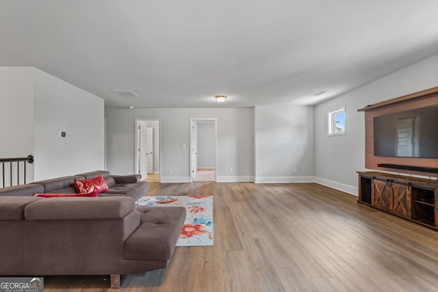 279 Sturry Dr, Mcdonough, GA 30252 - living room with wood finished floors, visible vents, and baseboards