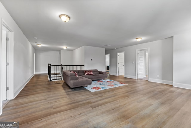 279 Sturry Dr, Mcdonough, GA 30252 - living area with baseboards and light wood-style flooring