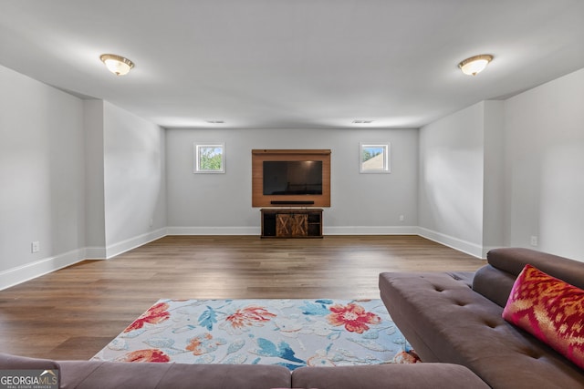 279 Sturry Dr, Mcdonough, GA 30252 - living area with baseboards and wood finished floors