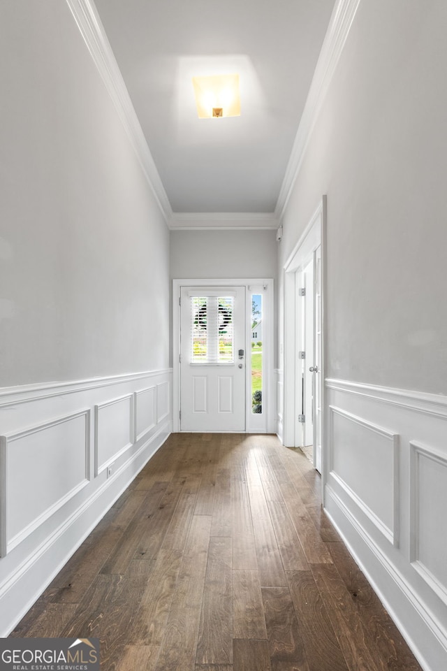 279 Sturry Dr, Mcdonough, GA 30252 - doorway to outside featuring dark wood finished floors, a decorative wall, ornamental molding, and wainscoting