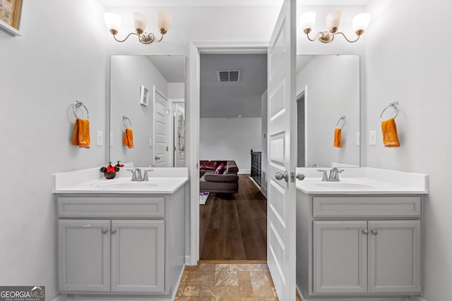 279 Sturry Dr, Mcdonough, GA 30252 - full bath with two vanities, visible vents, and a sink