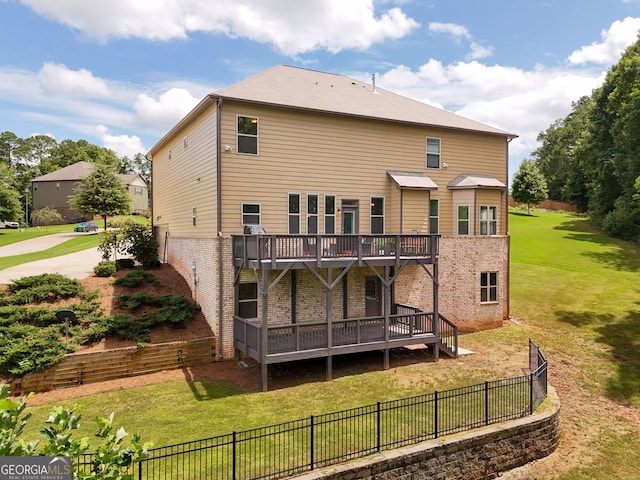 279 Sturry Dr, Mcdonough, GA 30252 - back of property with a wooden deck, a fenced backyard, brick siding, and a yard