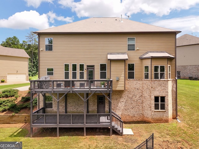 279 Sturry Dr, Mcdonough, GA 30252 - back of property featuring a wooden deck, brick siding, and a yard