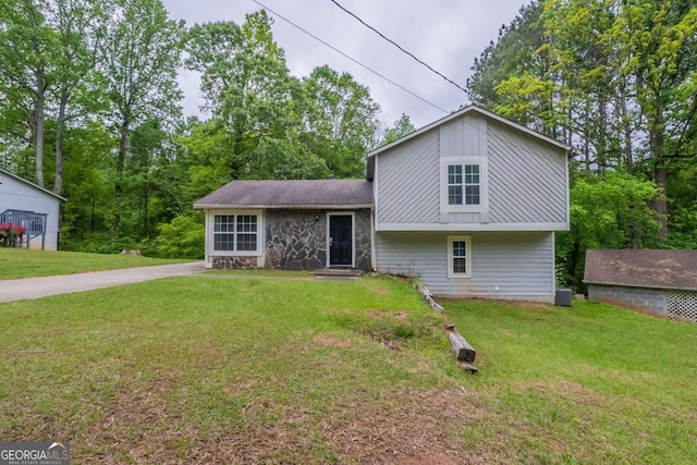 3897 Mcgill Dr, Decatur, GA 30034 - tri-level home featuring stone siding and a front yard