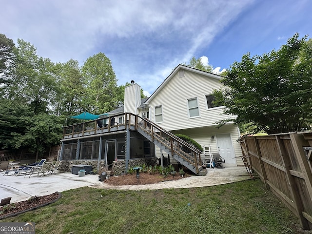 rear view of property featuring a fenced backyard, a patio, a yard, and stairway