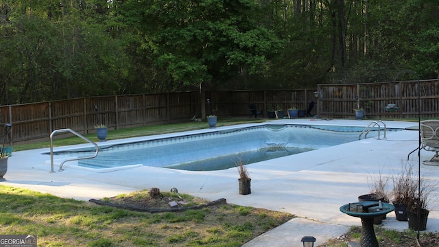view of pool featuring a patio, a fenced in pool, and a fenced backyard