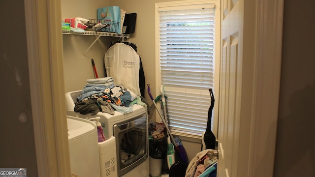 laundry room featuring washing machine and clothes dryer and laundry area