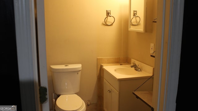half bath with toilet and vanity