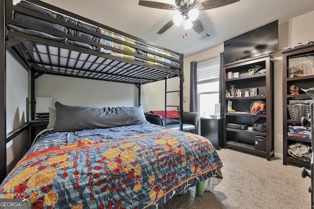bedroom featuring visible vents, a ceiling fan, and carpet floors
