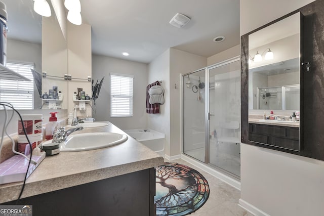 full bath featuring visible vents, a shower stall, double vanity, and a sink