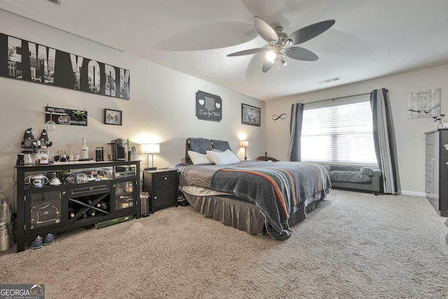bedroom with visible vents, ceiling fan, and carpet floors