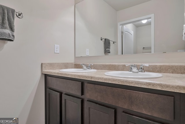 bathroom featuring double vanity and a sink