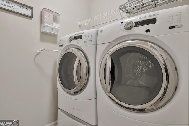 laundry room with independent washer and dryer and laundry area