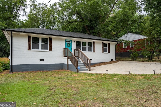 831 Catherine St, Forest Park, GA 30297 - view of front facade featuring brick siding, crawl space, a patio area, and a front lawn