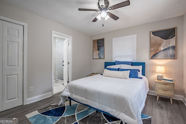 831 Catherine St, Forest Park, GA 30297 - bedroom with baseboards, a ceiling fan, ensuite bathroom, and wood finished floors