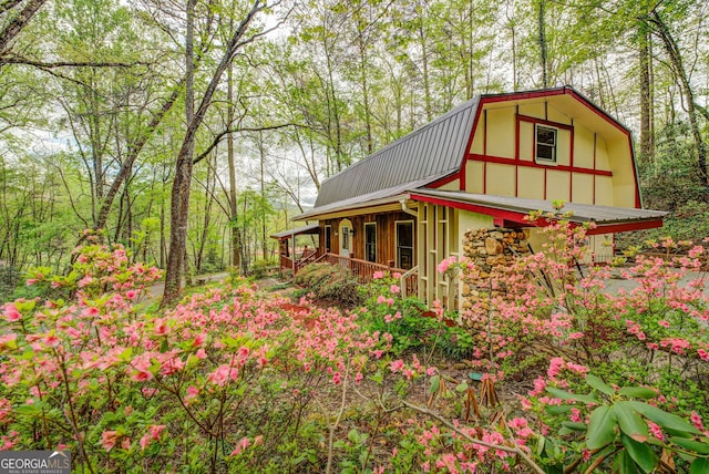 63 Eagle Chase Cir, Dillard, GA 30537 - view of side of property with a gambrel roof, metal roof, and covered porch