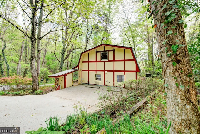 63 Eagle Chase Cir, Dillard, GA 30537 - view of outdoor structure featuring a forest view