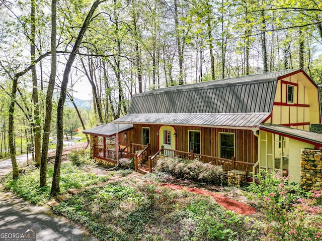 63 Eagle Chase Cir, Dillard, GA 30537 - view of front of house featuring a porch, a metal roof, and a gambrel roof