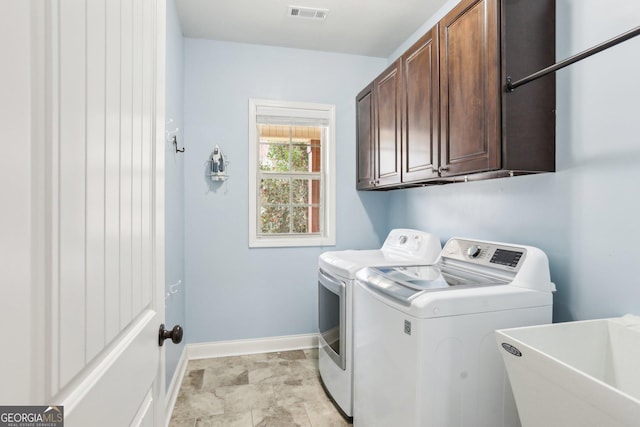 108 Turnberry Trce, Sharpsburg, GA 30277 - washroom featuring separate washer and dryer and cabinet space