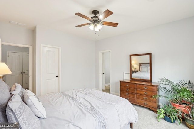 108 Turnberry Trce, Sharpsburg, GA 30277 - bedroom featuring light colored carpet, a ceiling fan, and a closet