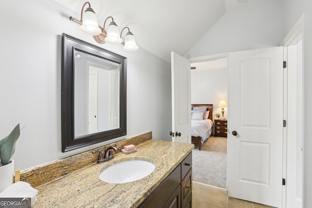 108 Turnberry Trce, Sharpsburg, GA 30277 - ensuite bathroom with vanity, vaulted ceiling, and tile patterned flooring
