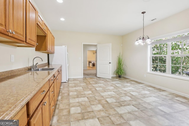 108 Turnberry Trce, Sharpsburg, GA 30277 - kitchen with a chandelier, decorative light fixtures, recessed lighting, light stone counters, and stone finish floors