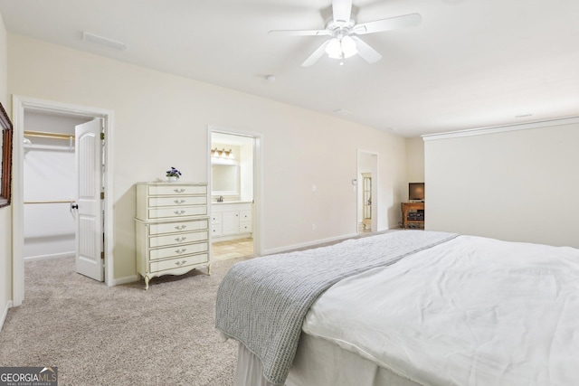 108 Turnberry Trce, Sharpsburg, GA 30277 - bedroom with a spacious closet, light colored carpet, a closet, ensuite bath, and a ceiling fan