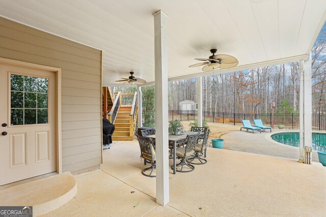 108 Turnberry Trce, Sharpsburg, GA 30277 - fenced backyard featuring stairs, a ceiling fan, a patio area, and outdoor dining area