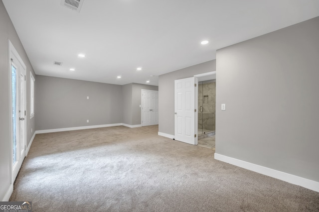 interior space with visible vents, recessed lighting, baseboards, and light carpet