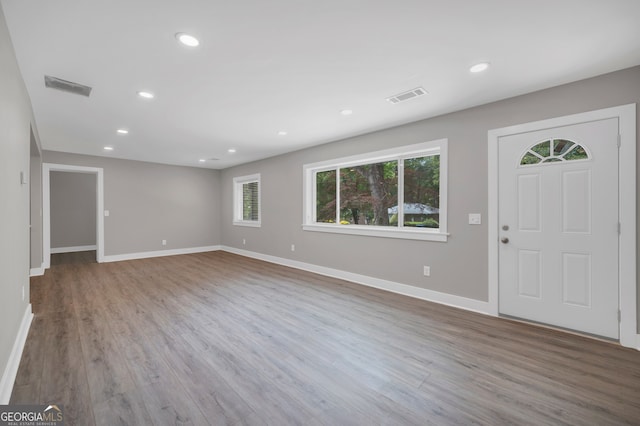 entrance foyer featuring wood finished floors, visible vents, recessed lighting, and baseboards
