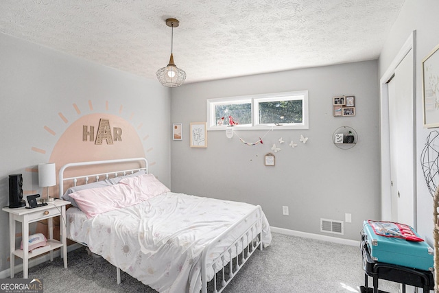 205 Tamea Trl, Covington, GA 30014 - bedroom featuring carpet flooring, a textured ceiling, and baseboards