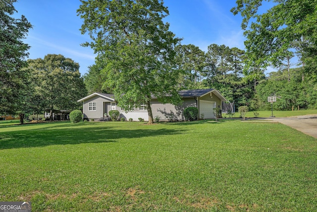 205 Tamea Trl, Covington, GA 30014 - view of front of house featuring a front yard and a garage