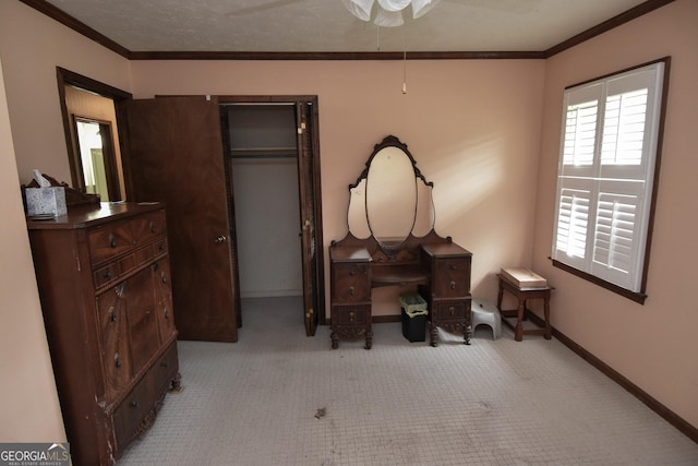 bedroom with baseboards, crown molding, and carpet