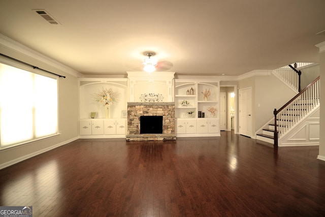 1142 Terrasol Rdg SW, Lilburn, GA 30047 - unfurnished living room featuring visible vents, crown molding, a fireplace, stairs, and dark wood-style flooring