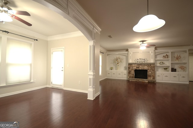1142 Terrasol Rdg SW, Lilburn, GA 30047 - unfurnished living room featuring arched walkways, dark wood-style flooring, ceiling fan, and a fireplace