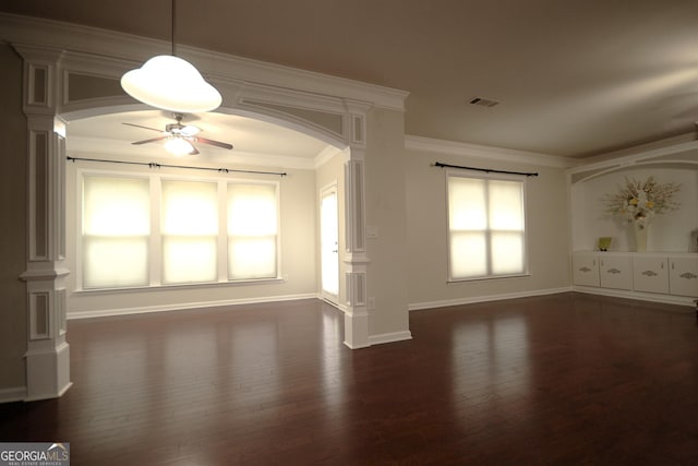 1142 Terrasol Rdg SW, Lilburn, GA 30047 - unfurnished living room with arched walkways, dark wood-style flooring, visible vents, ornate columns, and ceiling fan